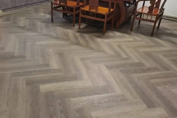 Herringbone pattern wood-look flooring in elegant interior